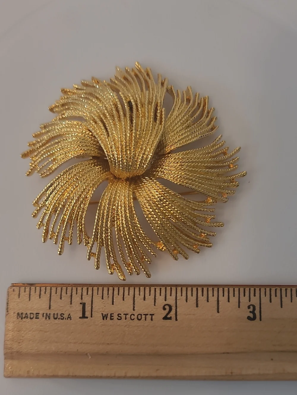 Monet Vintage Cordelia Gold Tone Starburst Brooch with Textured Metal Threads